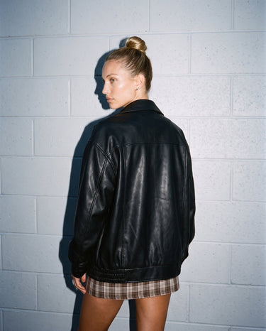 Back view of the black Marseille Faux Leather Jacket on model
