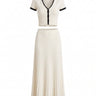 Mireva Knit Set in cream white — cropped V-neck knit top and pleated midi skirt with black trim, flat-lay