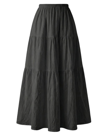The Noemi A-Line Skirt in black — tiered A-line maxi skirt with elastic waist, product flat-lay