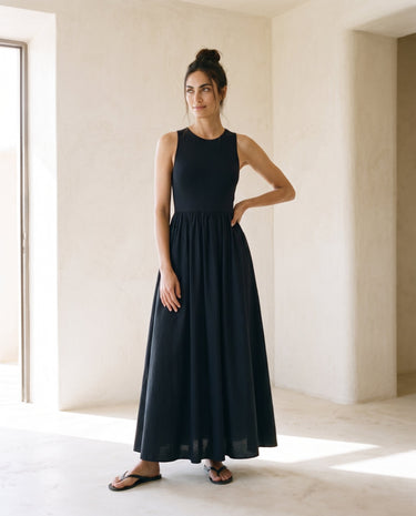 Noir Everyday Sleeveless Dress in black — sleeveless crew-neck maxi dress, front view on model