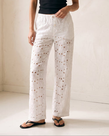 Noire Embroidered Straight Leg Pants in white — embroidered straight-leg trousers, front styling view on model
