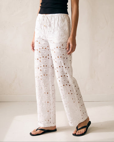 Noire Embroidered Straight Leg Pants in white — embroidered trousers, three-quarter back view on model