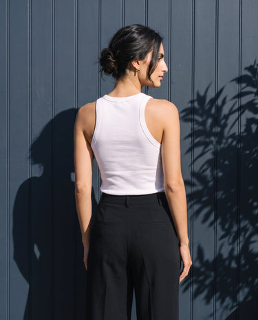Back view of the white ribbed cotton tank showing the racer-style shoulders – Moriel Heritage