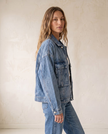 Oakley Denim Jacket in blue — classic denim jacket, side view on model