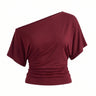 Odile Tee in burgundy — asymmetric off-shoulder draped knit top with dolman sleeves, flat-lay