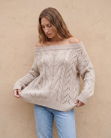 The Off Shoulder Cable Knit Sweater in khaki — off-shoulder cable-knit sweater, front view on model