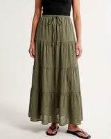 Olivia A-Line Skirt in sage green — tiered maxi skirt with drawstring waist, front view on model