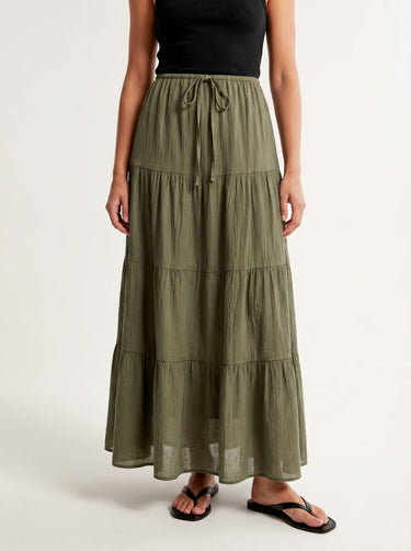 Olivia A-Line Skirt in sage green — tiered maxi skirt with drawstring waist, front view on model