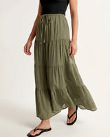 Olivia A-Line Skirt in sage green — tiered maxi skirt, walking view on model