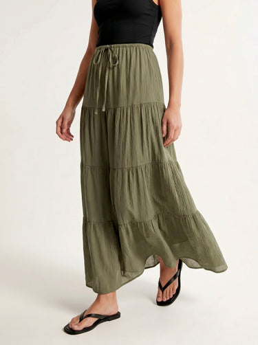 Olivia A-Line Skirt in sage green — tiered maxi skirt, walking view on model