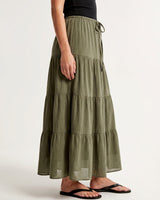 Olivia A-Line Skirt in sage green — tiered maxi skirt, side view on model