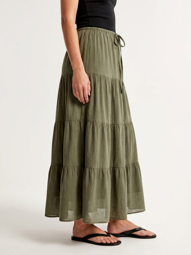 Olivia A-Line Skirt in sage green — tiered maxi skirt, side view on model