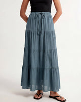 Olivia A-Line Skirt in blue — tiered maxi skirt, side view on model