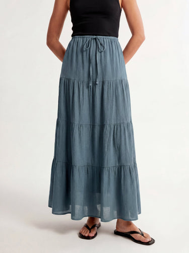 Olivia A-Line Skirt in blue — tiered maxi skirt, side view on model