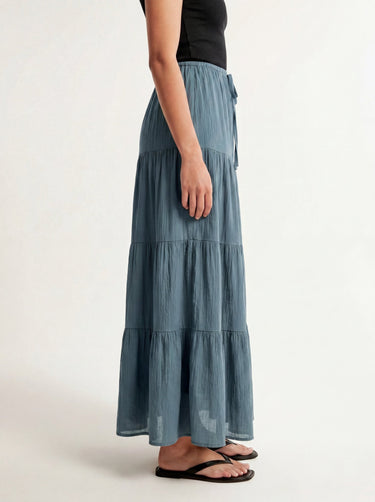 Olivia A-Line Skirt in blue — tiered maxi skirt, side view on model