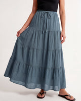 Olivia A-Line Skirt in blue — tiered maxi skirt, walking view on model