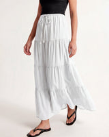 Olivia A-Line Skirt in white — tiered maxi skirt, walking view on model