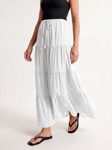 Olivia A-Line Skirt in white — tiered maxi skirt, walking view on model