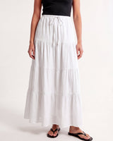 Olivia A-Line Skirt in white — tiered maxi skirt, three-quarter view on model