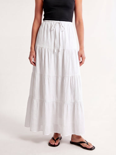 Olivia A-Line Skirt in white — tiered maxi skirt, three-quarter view on model
