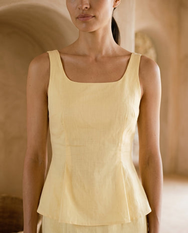 Yellow cinched-waist strap top close-up on model – Moriel Heritage