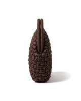The Ravello Woven Clutch in brown, side profile view showing the slim depth