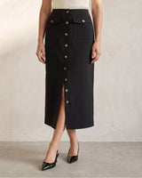 Front view of the black Elegant Retro Slimming Skirt showing the buttoned placket, flap pockets and mid-calf length