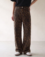 Rhea Leopard Print Jeans — leopard-print mid-rise jeans, front view on model with hand on hip