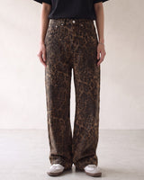 Rhea Leopard Print Jeans — brown leopard-print straight-leg jeans styled with a black tee, front view on model