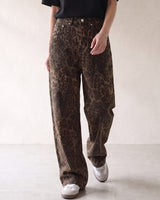 Rhea Leopard Print Jeans — brown leopard-print jeans in motion, walking view on model