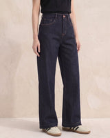Model wearing dark denim high-rise wide-leg jeans, three-quarter front view – Moriel Heritage