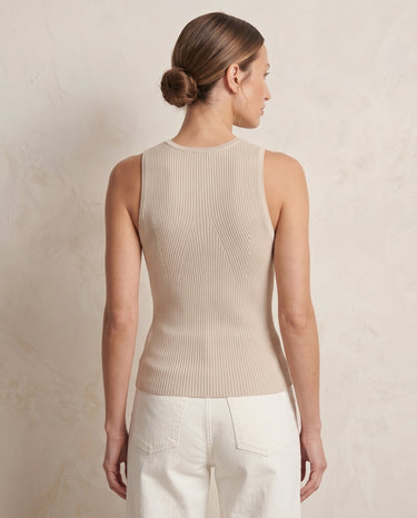Ryah Ribbed Knit Vest Top in beige — sleeveless ribbed knit top, back three-quarter view on model