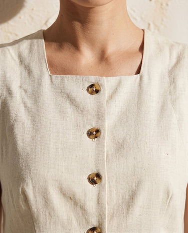 Cream vest and skirt set, button neckline close-up – Moriel Heritage