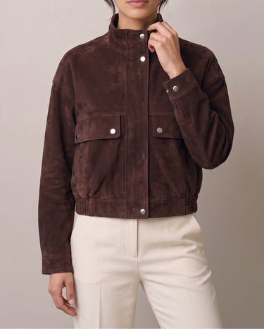 Brown Salome Jacket on model with cream trousers, front view – Moriel Heritage