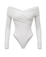 White off-shoulder long-sleeve bodysuit with crossover draped front, flat-lay front view – Moriel Heritage