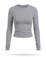 Light grey fitted long-sleeve crew-neck top with ruched cuffs, flat-lay front view – Moriel Heritage