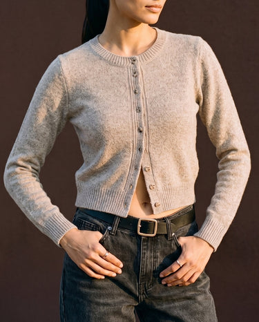 Short Knitted Cardigan in beige — front view on model