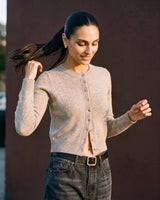 Short Knitted Cardigan in beige — front view on model