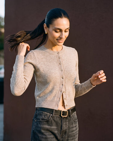 Short Knitted Cardigan in beige — front view on model