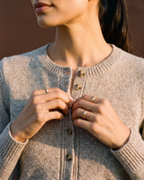 Short Knitted Cardigan in beige — close-up of the neckline and buttons