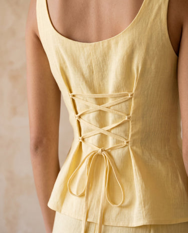 Yellow set, lace-up back detail close-up – Moriel Heritage