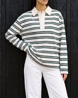 Stripe Long Sleeve Polo in green — front view on model, styled with white jeans