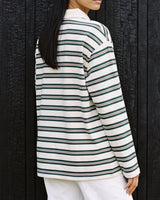 Stripe Long Sleeve Polo in green — side view on model showing the relaxed drop-shoulder fit