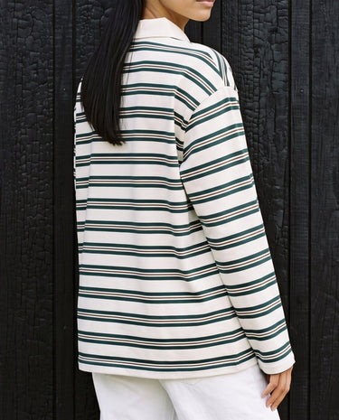 Stripe Long Sleeve Polo in green — side view on model showing the relaxed drop-shoulder fit