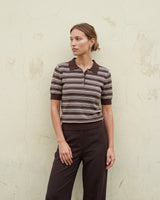 Stripe Short Sleeve Polo in cocoa — full-length front view on model against a pale wall