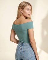 Three-quarter back view of the green off-shoulder top – Moriel Heritage