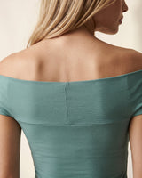 Close-up of the green top's back neckline sitting across the shoulder blades – Moriel Heritage