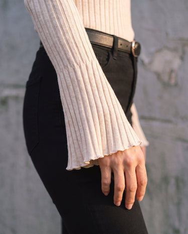 Sylvie Body Suit in white — close-up of the flared bell sleeve