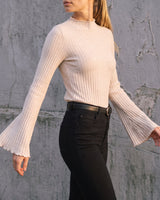 Sylvie Body Suit in white — side view on model