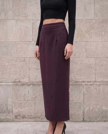 The Aisla Burgundy Skirt in burgundy — high-waisted straight maxi skirt, front view on model